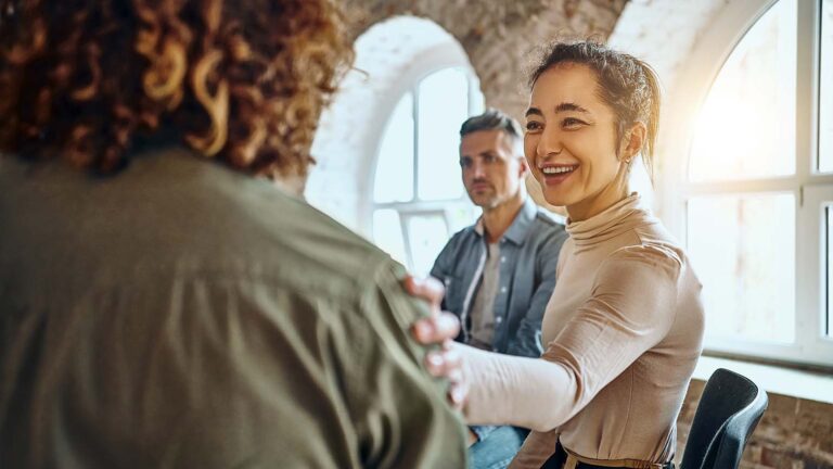 Woman in support group encourages another woman about her lent plan