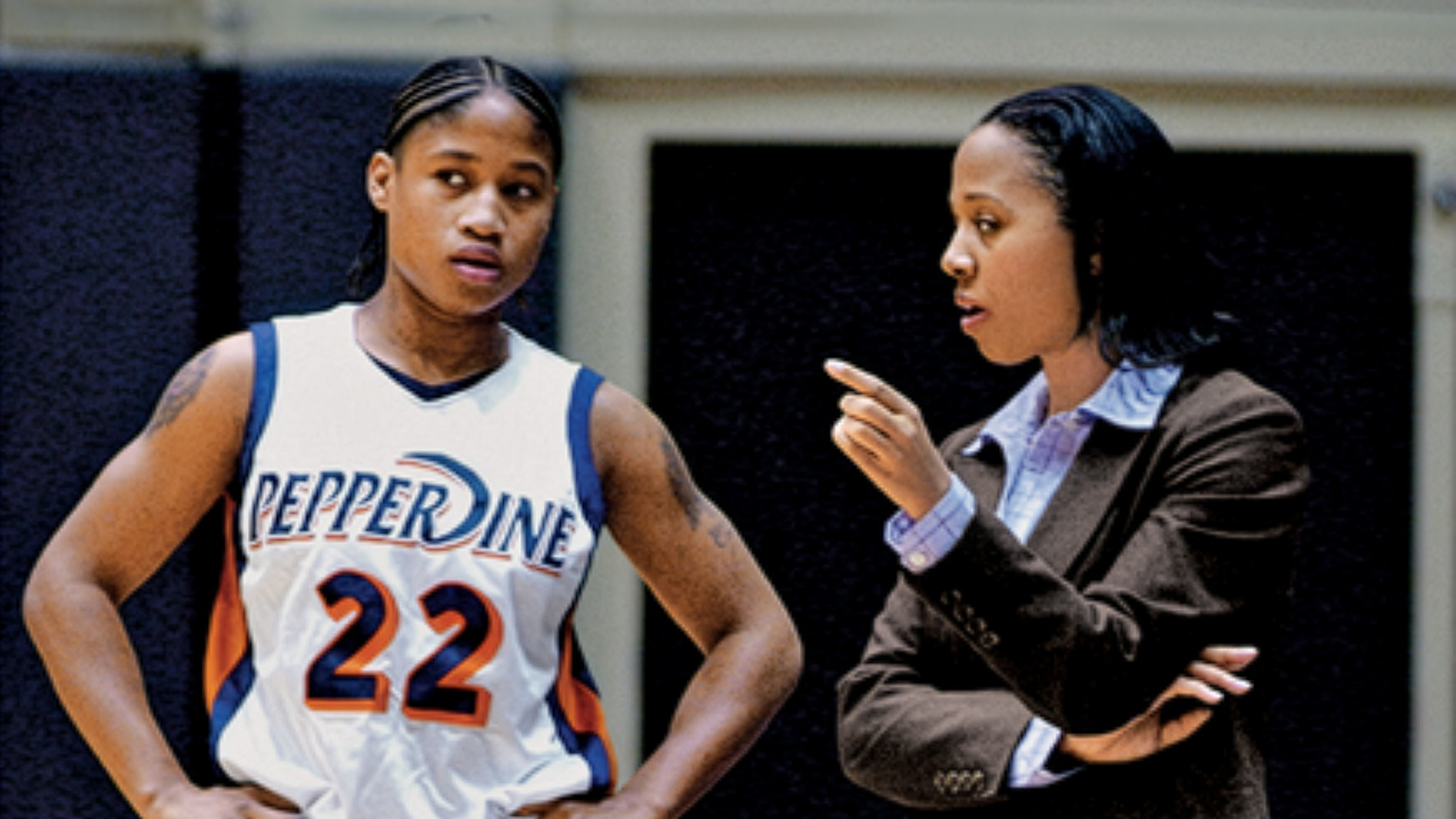 Julie Rousseau strategizes with her coach; photo courtesy Pepperdine University