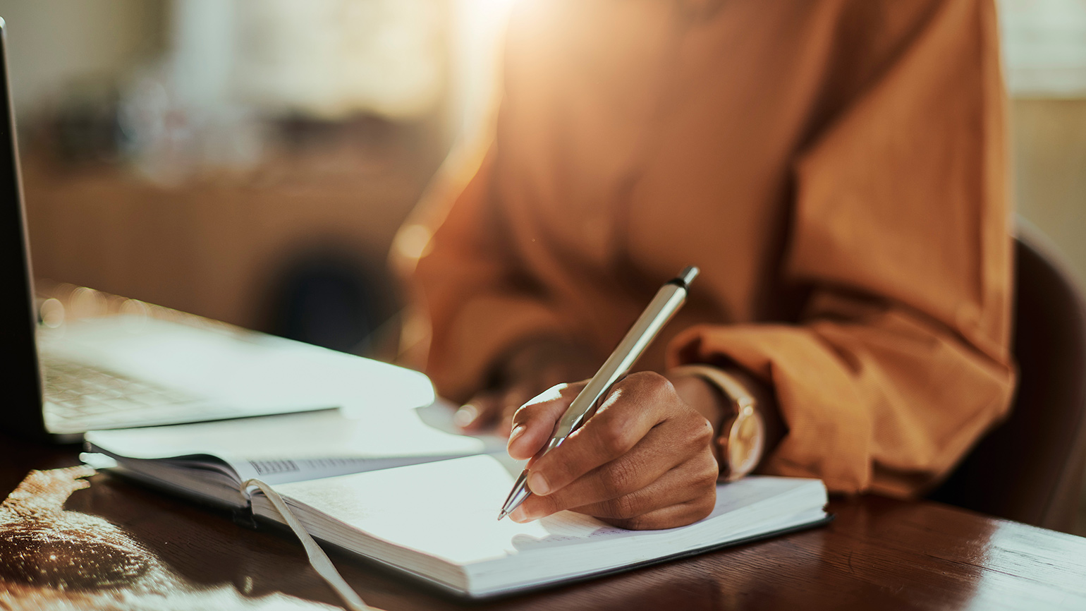 Woman writing in a notebook
