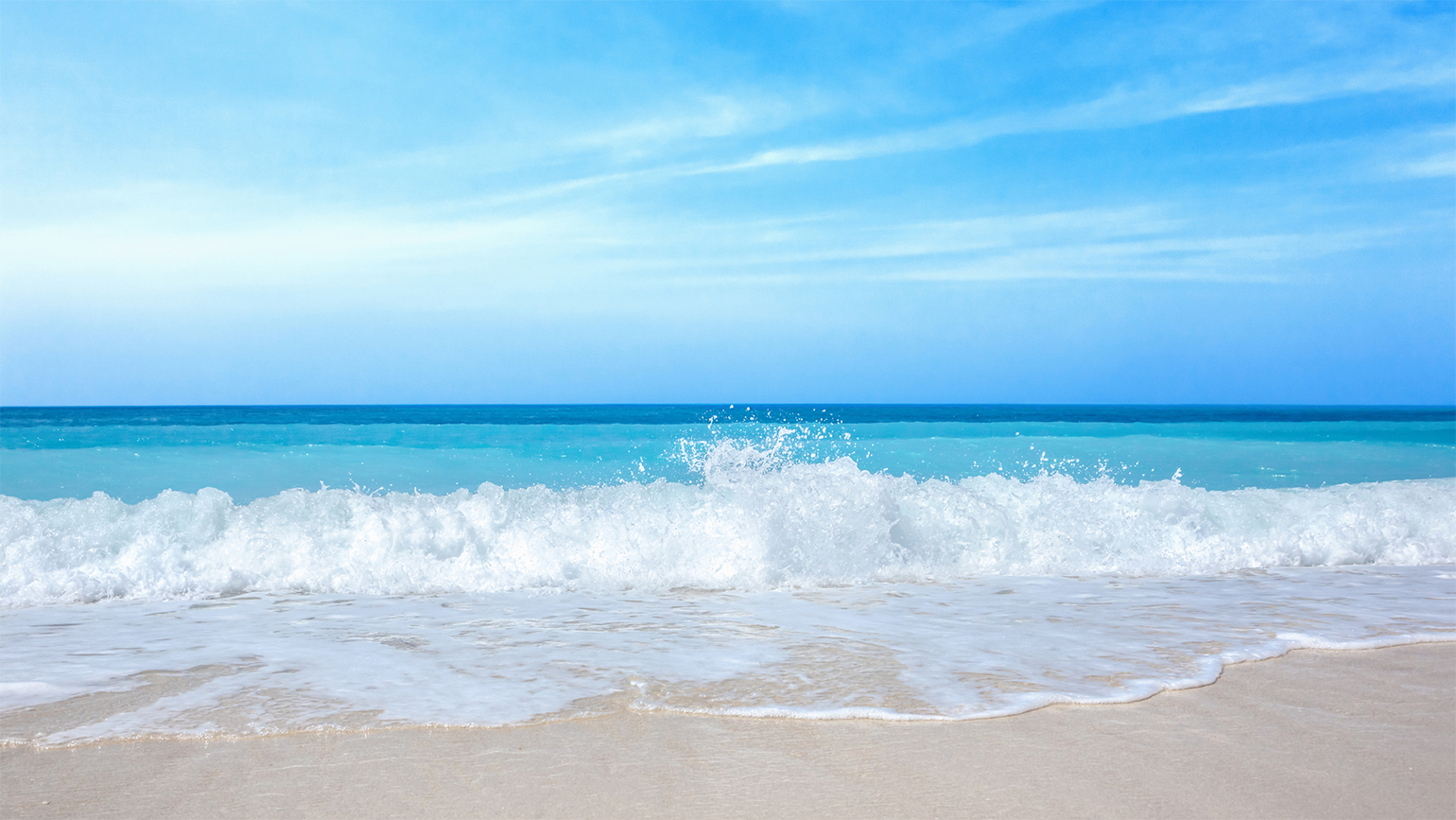 A view of the horizon from a sunny beach; Getty Images