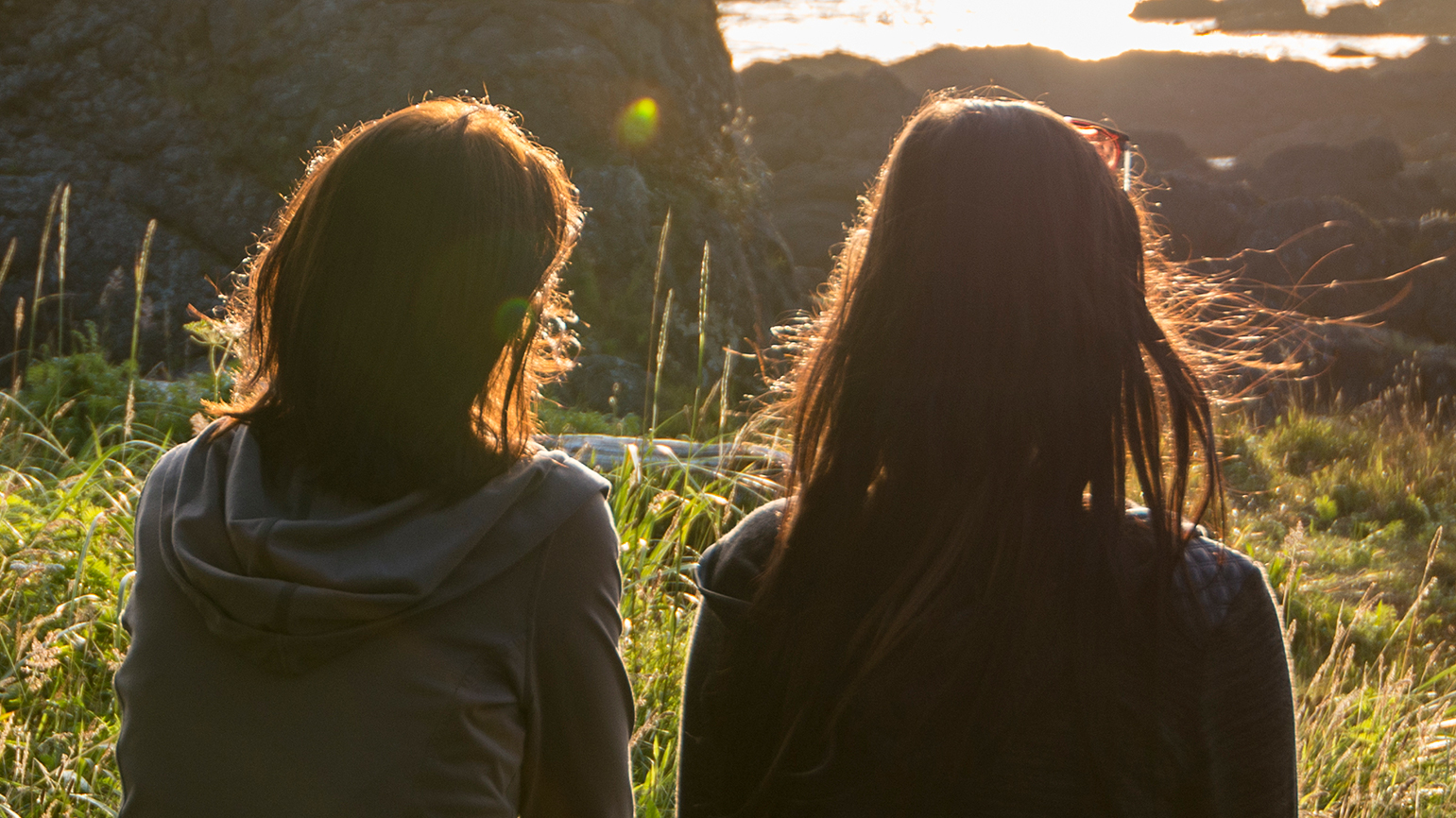 Two women sharing their grief; Getty Images