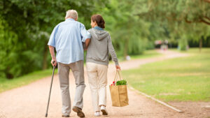 Woman helping senior man with shopping