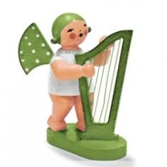 An angel figurine strumming a harp