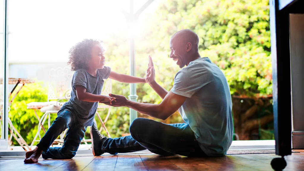 A father and son enjoy Father's Day on the porch