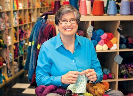 Lisa Bogart in the knitting store where she believes her angels guided her.
