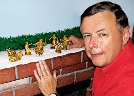 Steve Garrington poses with the treasured Nativity set he shares with his wife.