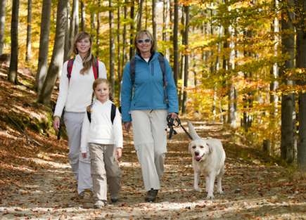 Happy family hiking in autumn.