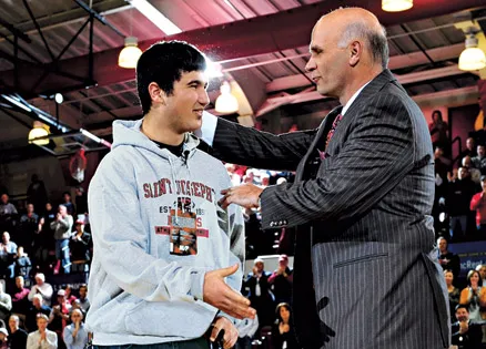 Lenny Martelli joins St. Joseph's coach Phil Martelli at midcourt