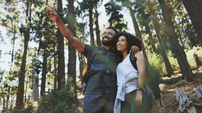 Happy couple going on a hike to give up staying inside for lent