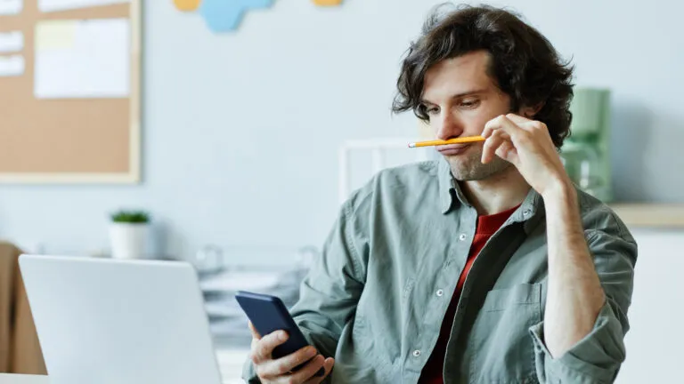 Man at his desk trying to give up procrastination for lent