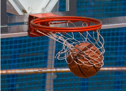 A basketball caroms through the hoop.