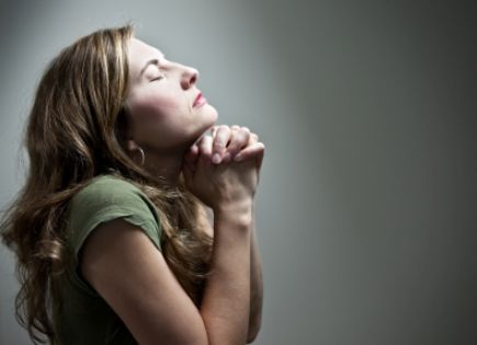 woman praying when worried