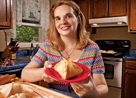 Patty Hammond displays a Festival Apple Dumpling.