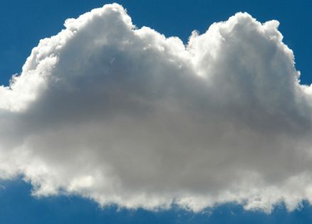 A single gray cloud in an otherwise blue sky