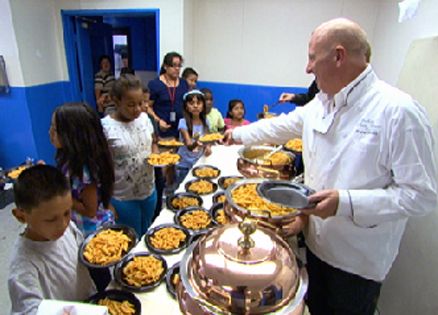 Bruno Serato, owner of the Whitehouse restaurant in Anaheim, serves the needy