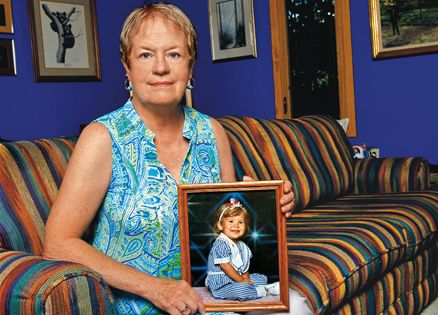 Julie Burns with a photograph of her granddaughter Paige