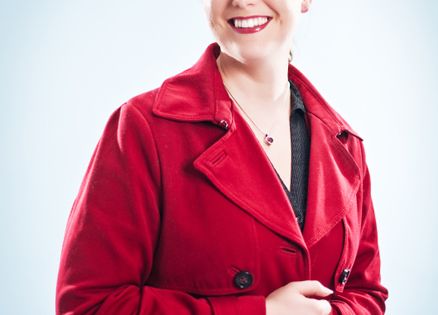 A woman wearing a red woolen coat
