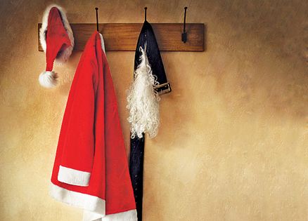 A Santa outfit hangs from a coat rack.