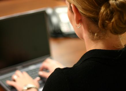 A woman at her laptop computer