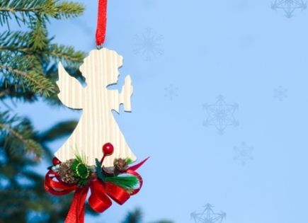 an angel ornament in a Christmas tree