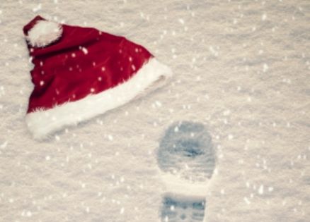 Santa hat and bootprints in the snow