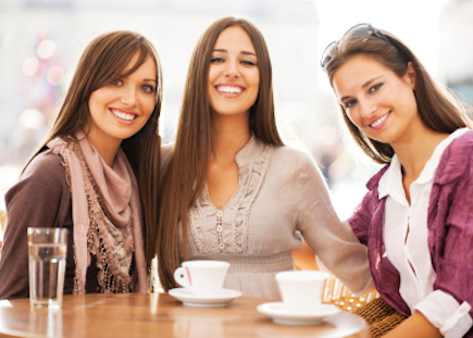 happy women friends having coffee