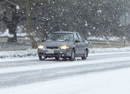 Car driving through blizzard