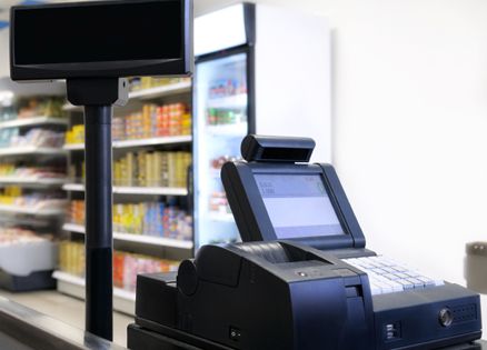 A cash register in a grocery store