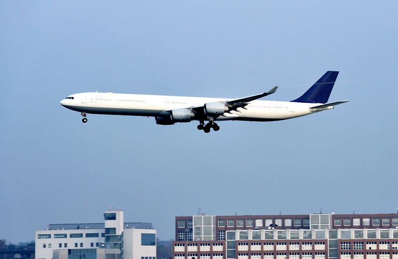 An airliner taking off from a metropolitan airport