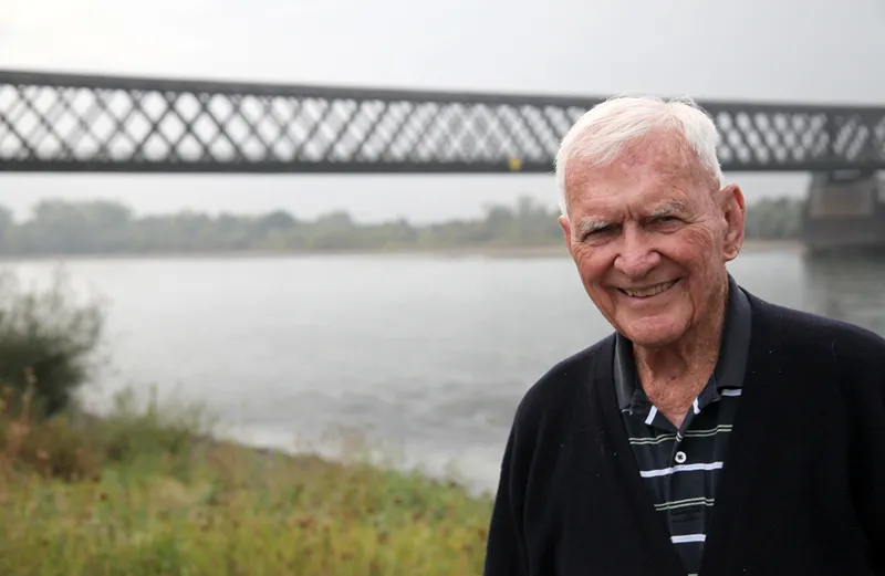 General Albin Irzyk poses in front of the bridge over the Eichel River.