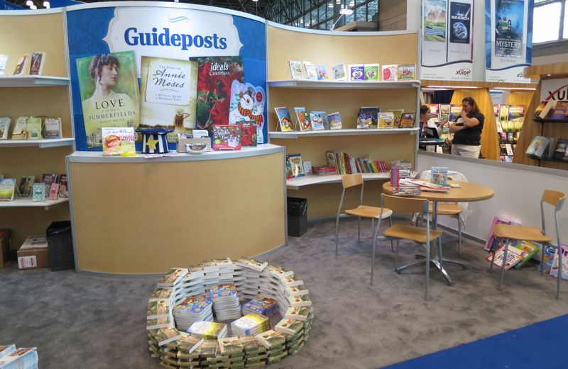 The Guideposts booth at Book Expo America, with piles and displays of books