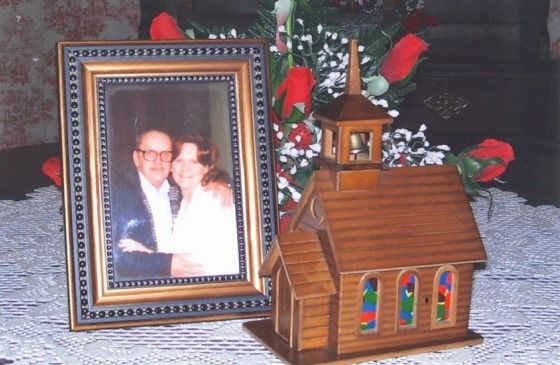 A framed photo of Barbara Womer and her dad beside the special music box.