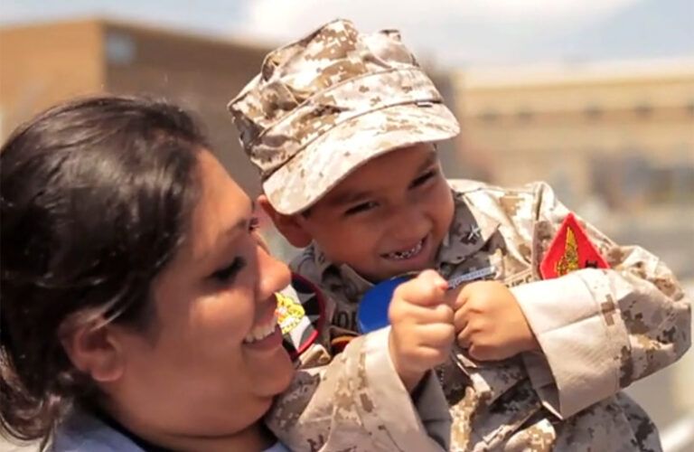 Young Jorge, in full Marine gear, and his mother