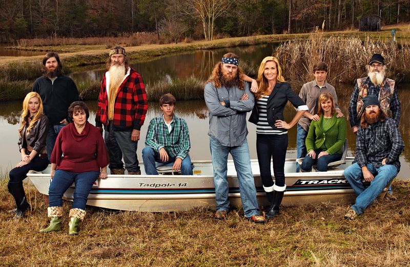 Korie Robertson (standing), husband Willie, and the Robertson family