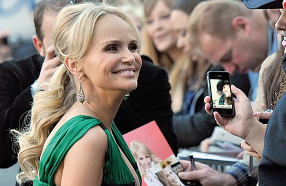 Kristin Chenoweth sign autographs and poses for pictures for her fans.