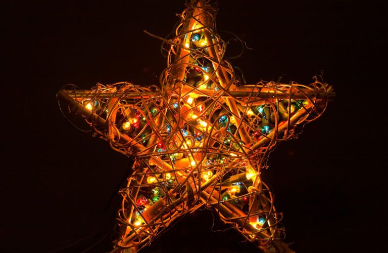 A star illuminated by many Christmas lights