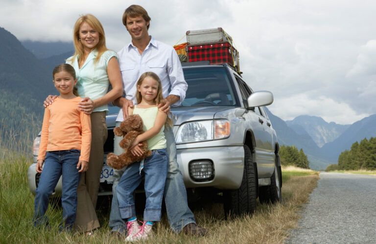 A family of four on vacation in the mountains