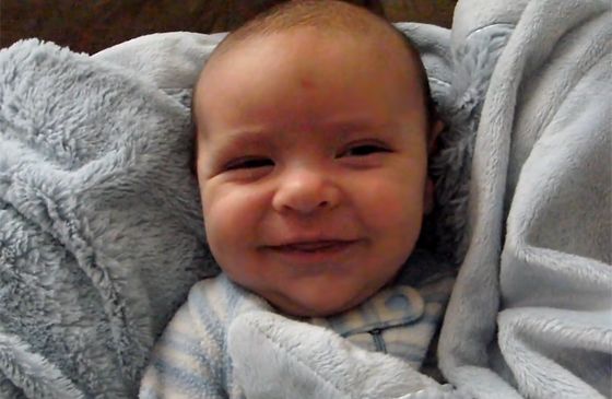 A grinning infant named Oliver