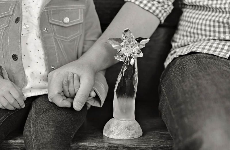 Ben Nunery and daughter Olivia with a glass angel; photo by Melanie Tracy Pace