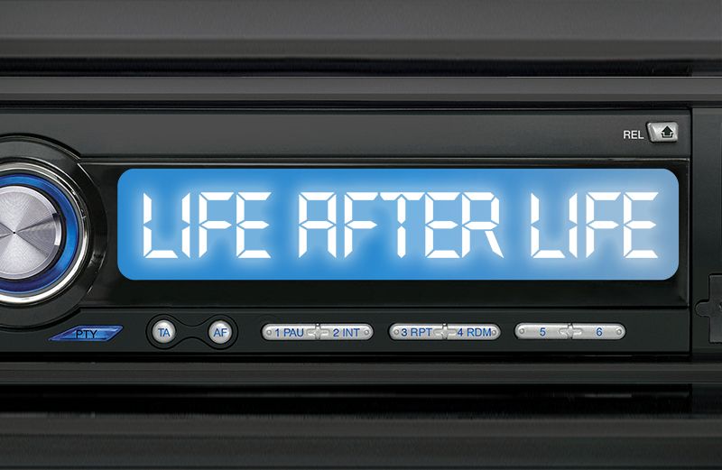 A car radio dial with the words "Life After Life" on it