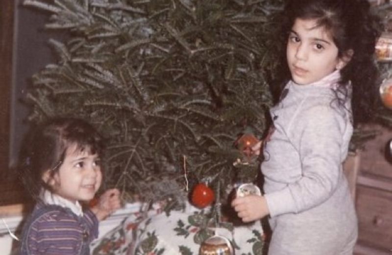 Mysterious Ways associate editor Diana Aydin trimming the tree at age 3.