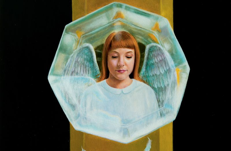 An artist's rendering of an angel reflected in a glass doorknoob