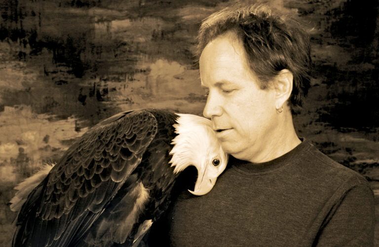 Jeff Guidry nuzzles Freedom the eagle