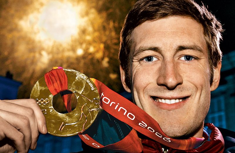 Joey Cheek poses with his gold medal in Torino.