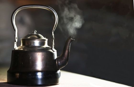 steam rising from a boiling tea kettle