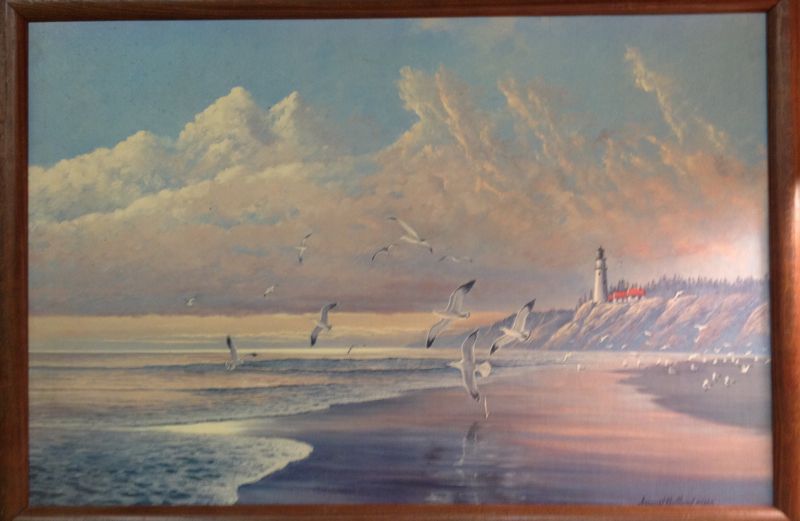A painting of a lighthouse on the beach from Publishers Clearing House