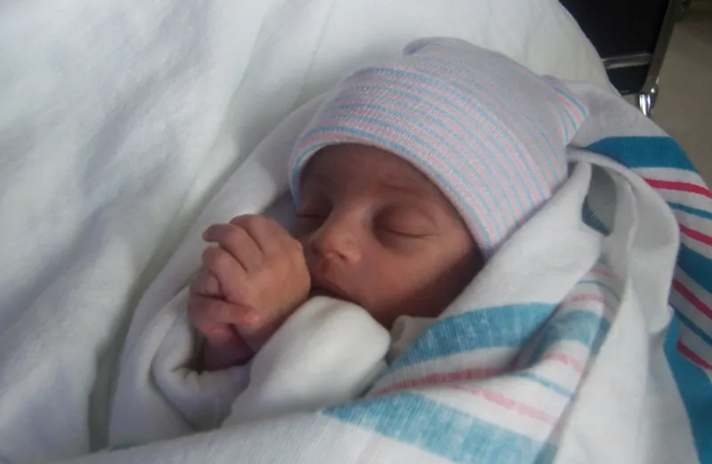 Crystal Clark-Archer's son, Izaiah, with his hands together as in prayer.