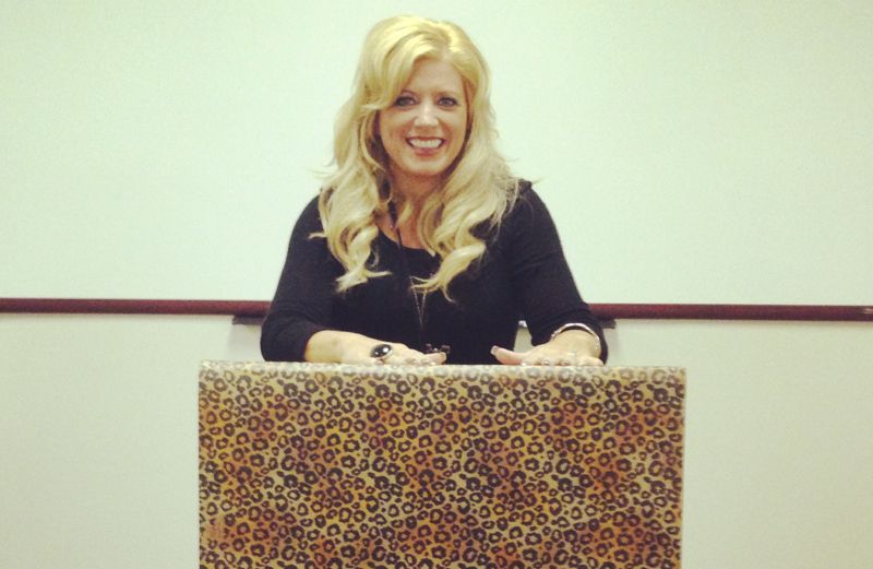 Inspirational Stories blogger Michelle Medlock Adams at a leopard print podium