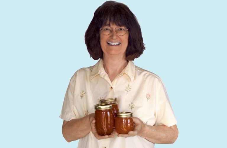 Wanda Rosseland holding jars of apricot jam