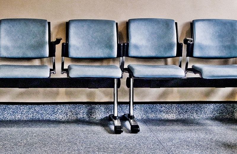 Empty chairs in a hospital waiting room